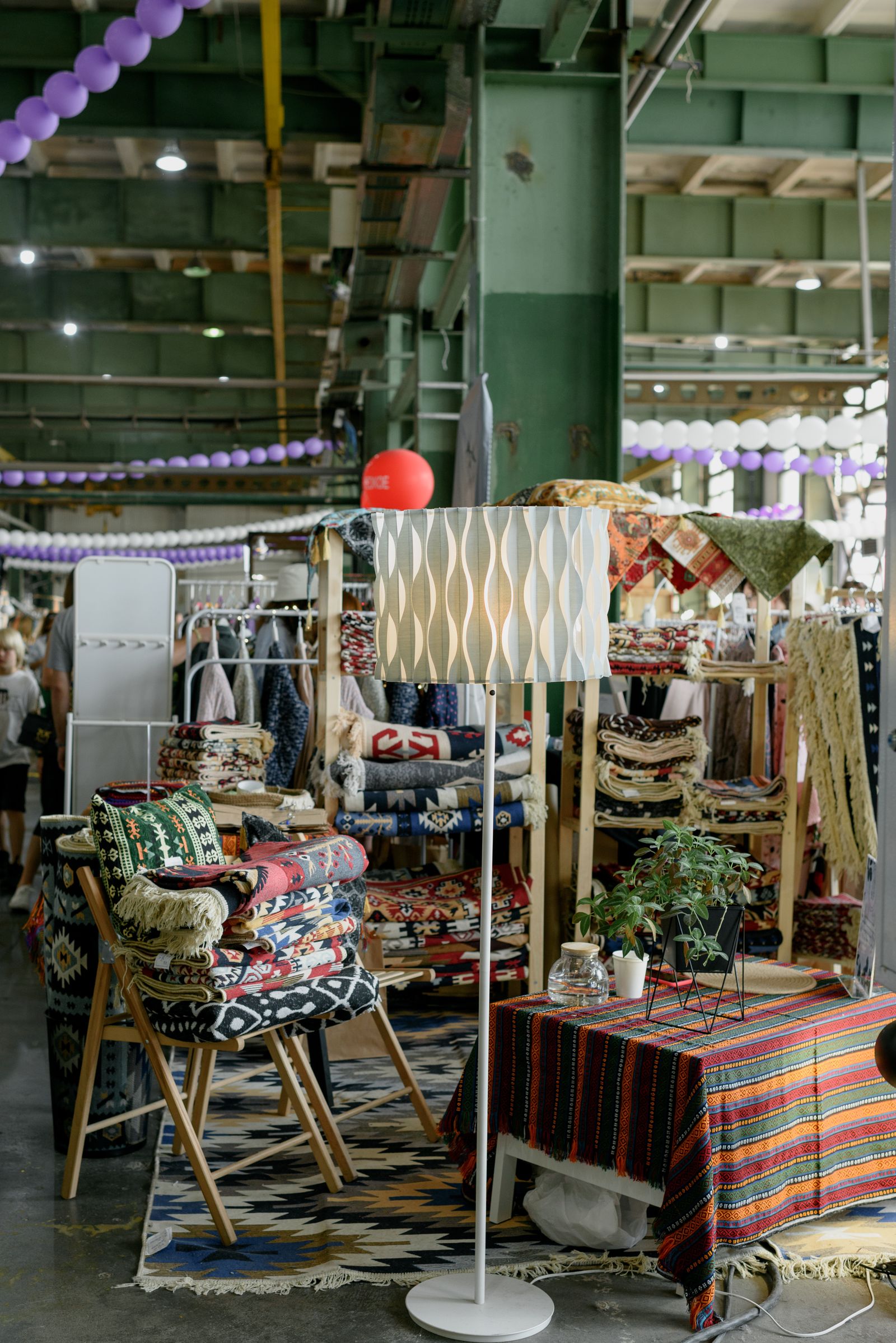 A busy market stall with products on display